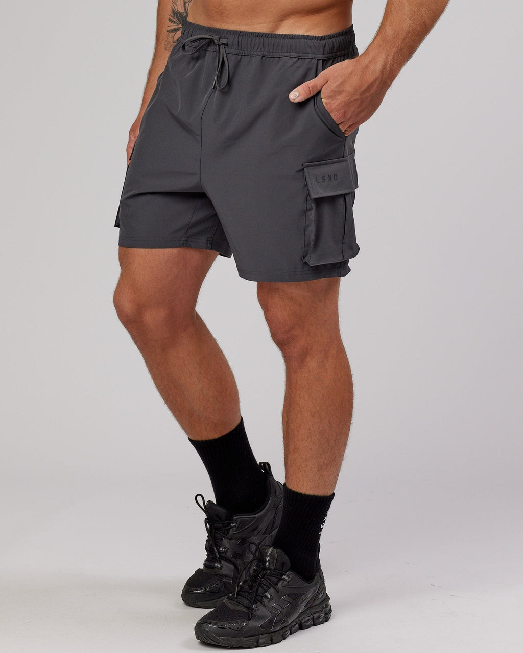 Model wearing Energy Stretch Performance Cargo Short - Asphalt