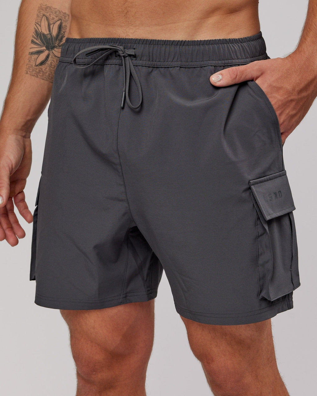 Model wearing Energy Stretch Performance Cargo Short - Asphalt
