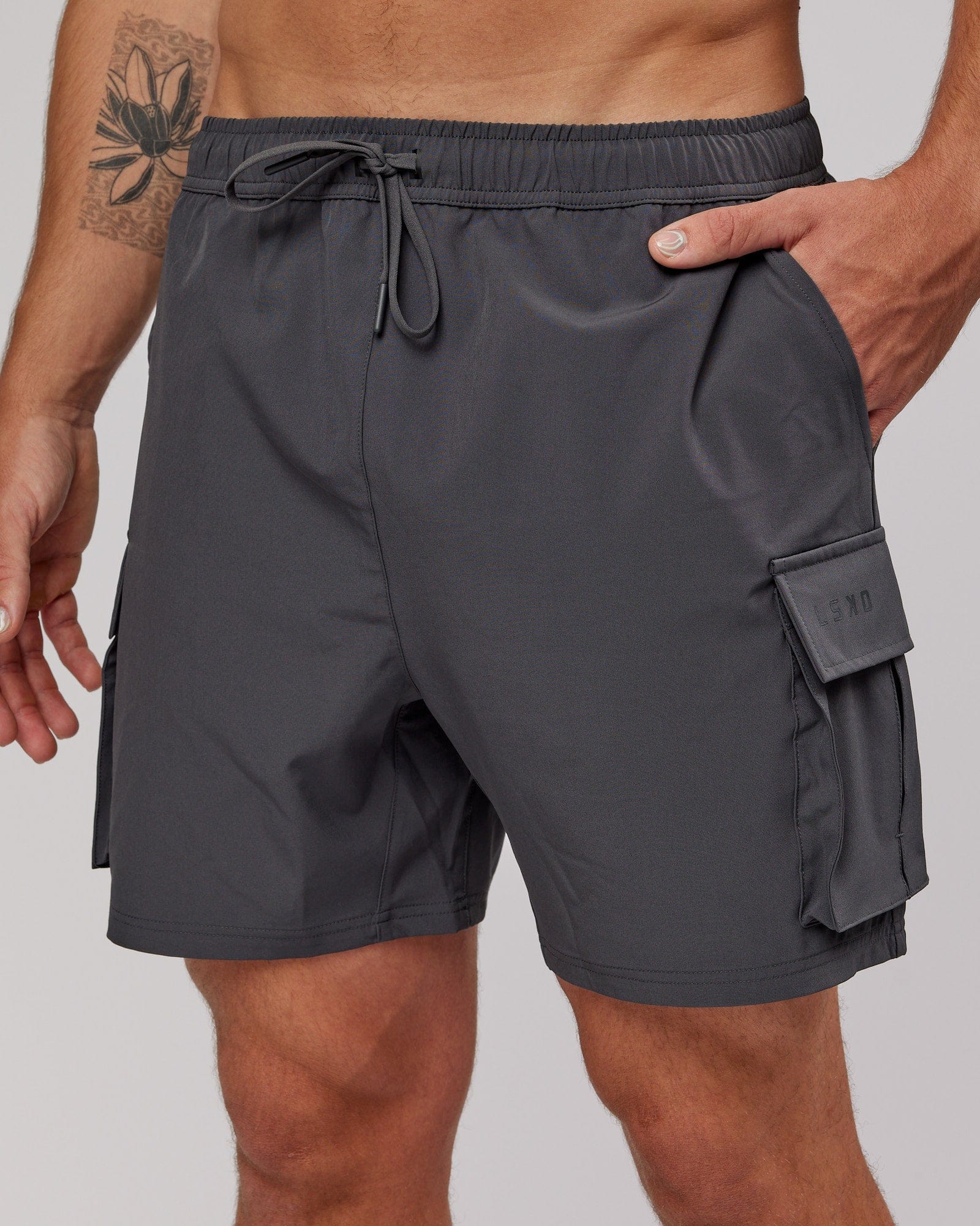 Model wearing Energy Stretch Performance Cargo Short - Asphalt