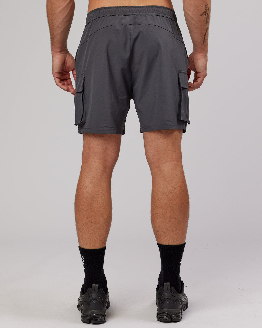 Model wearing Energy Stretch Performance Cargo Short - Asphalt