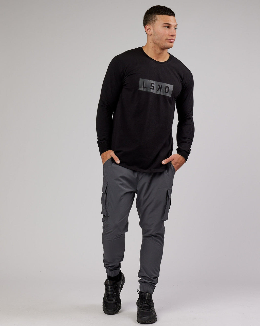 Model wearing Energy Stretch Performance Cargo Jogger - Asphalt