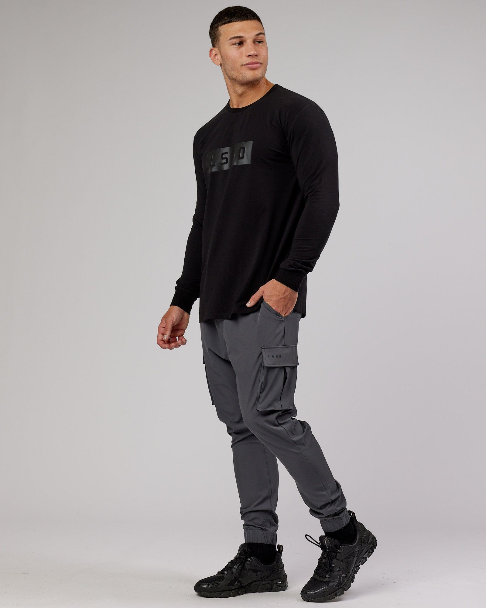 Model wearing Energy Stretch Performance Cargo Jogger - Asphalt