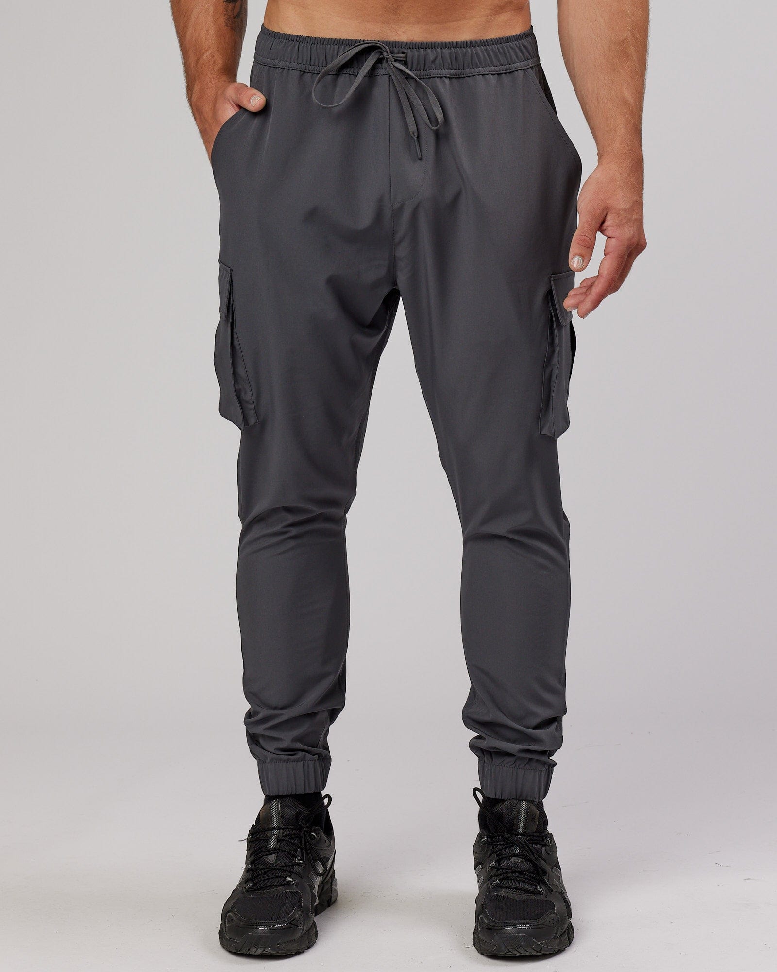 Model wearing Energy Stretch Performance Cargo Jogger - Asphalt