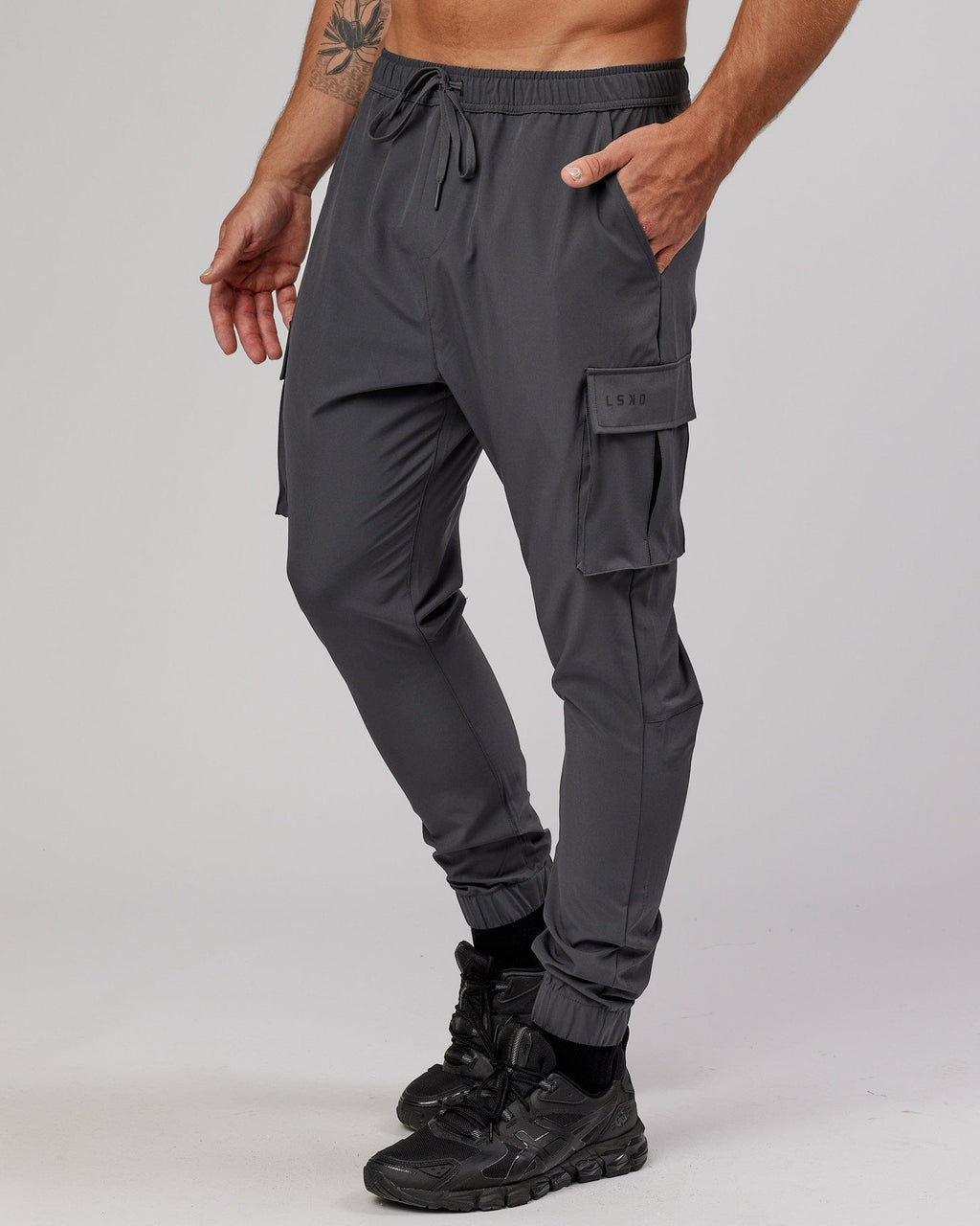 Model wearing Energy Stretch Performance Cargo Jogger - Asphalt