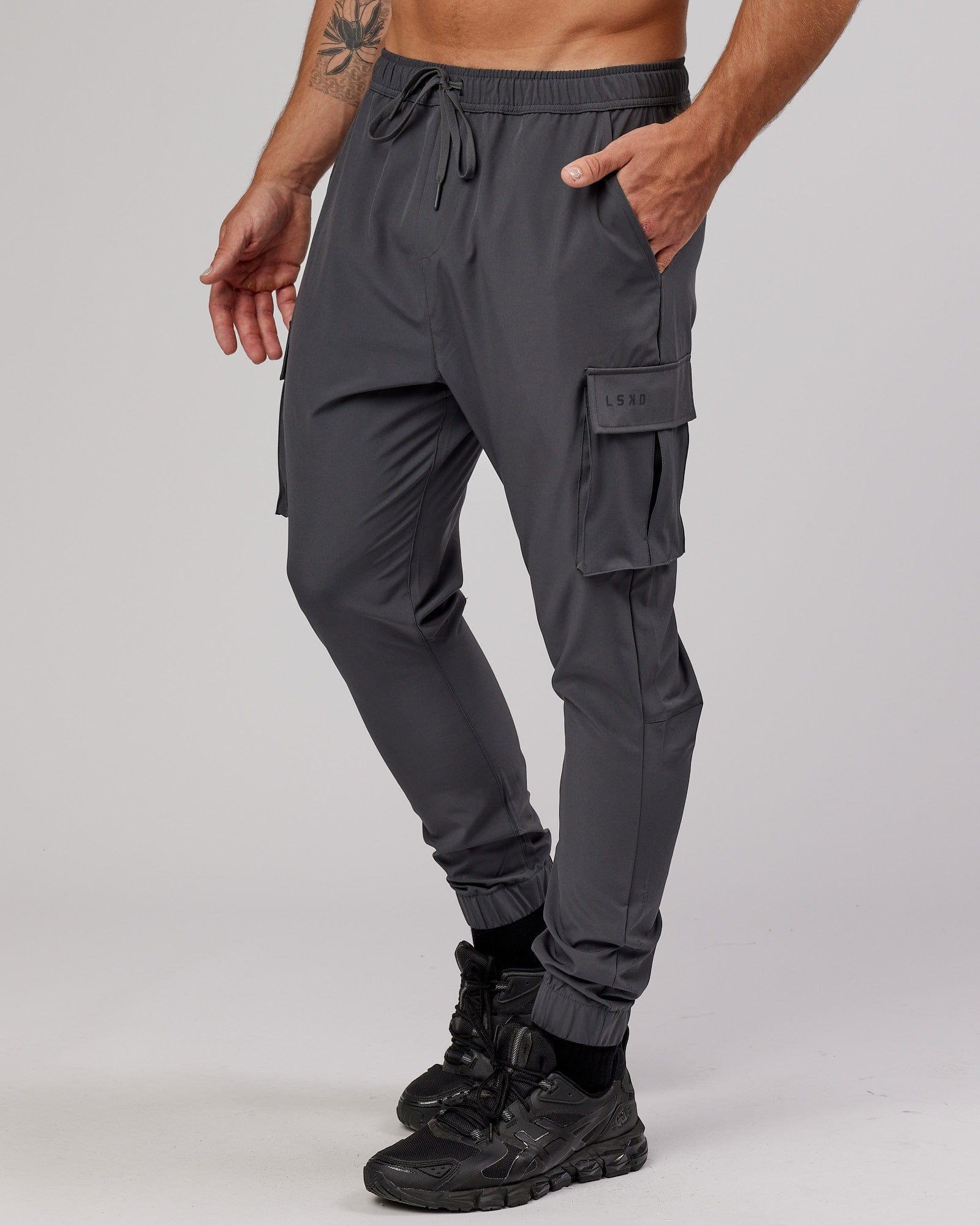 Model wearing Energy Stretch Performance Cargo Jogger - Asphalt