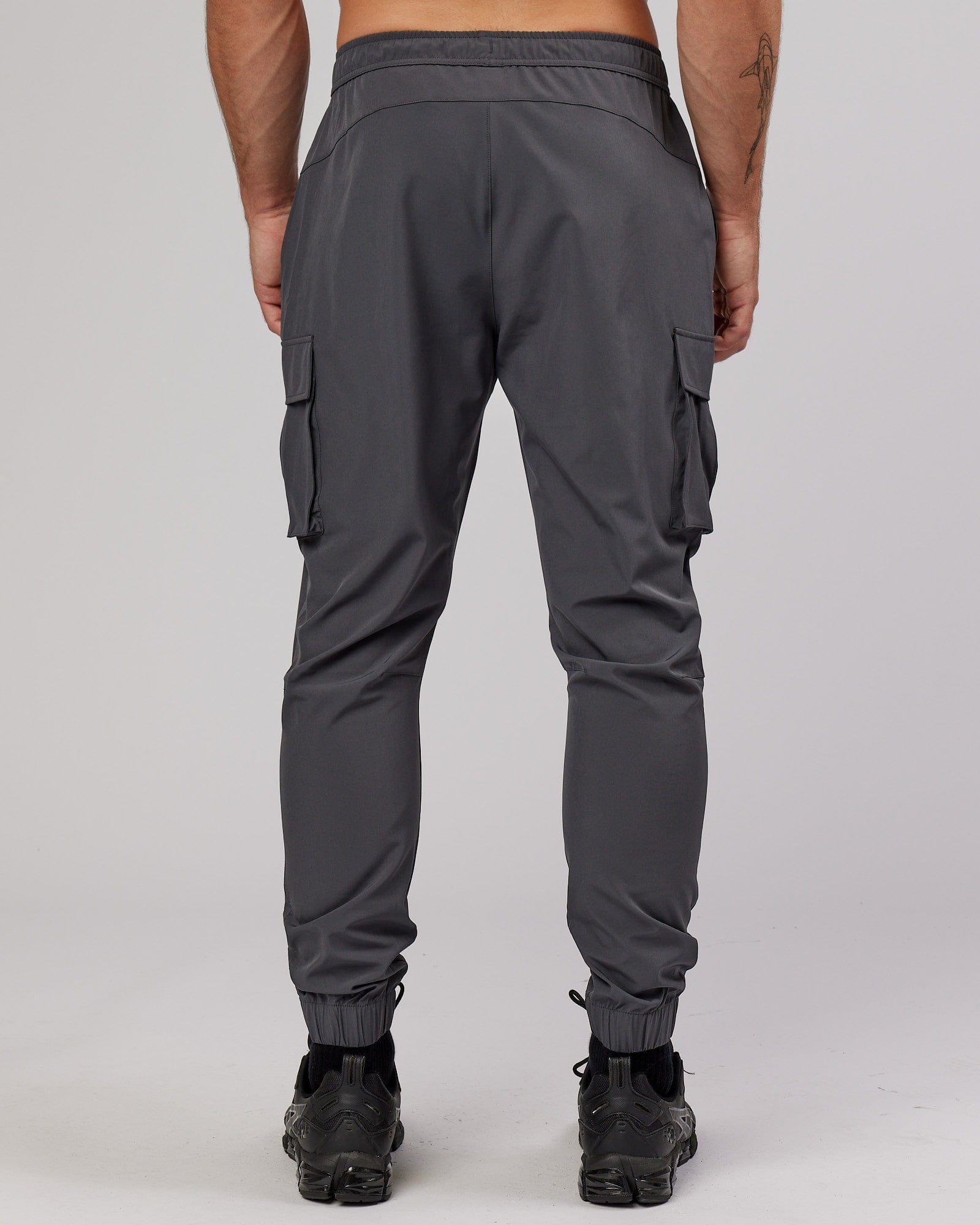 Model wearing Energy Stretch Performance Cargo Jogger - Asphalt