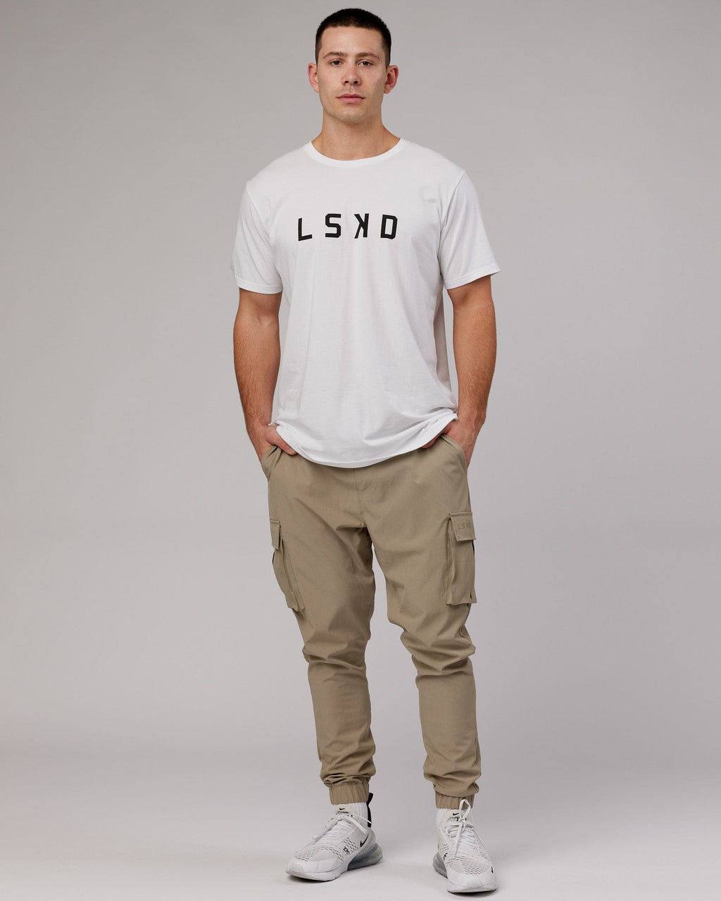 Model wearing Energy Stretch Performance Cargo Jogger - Laurel Oak