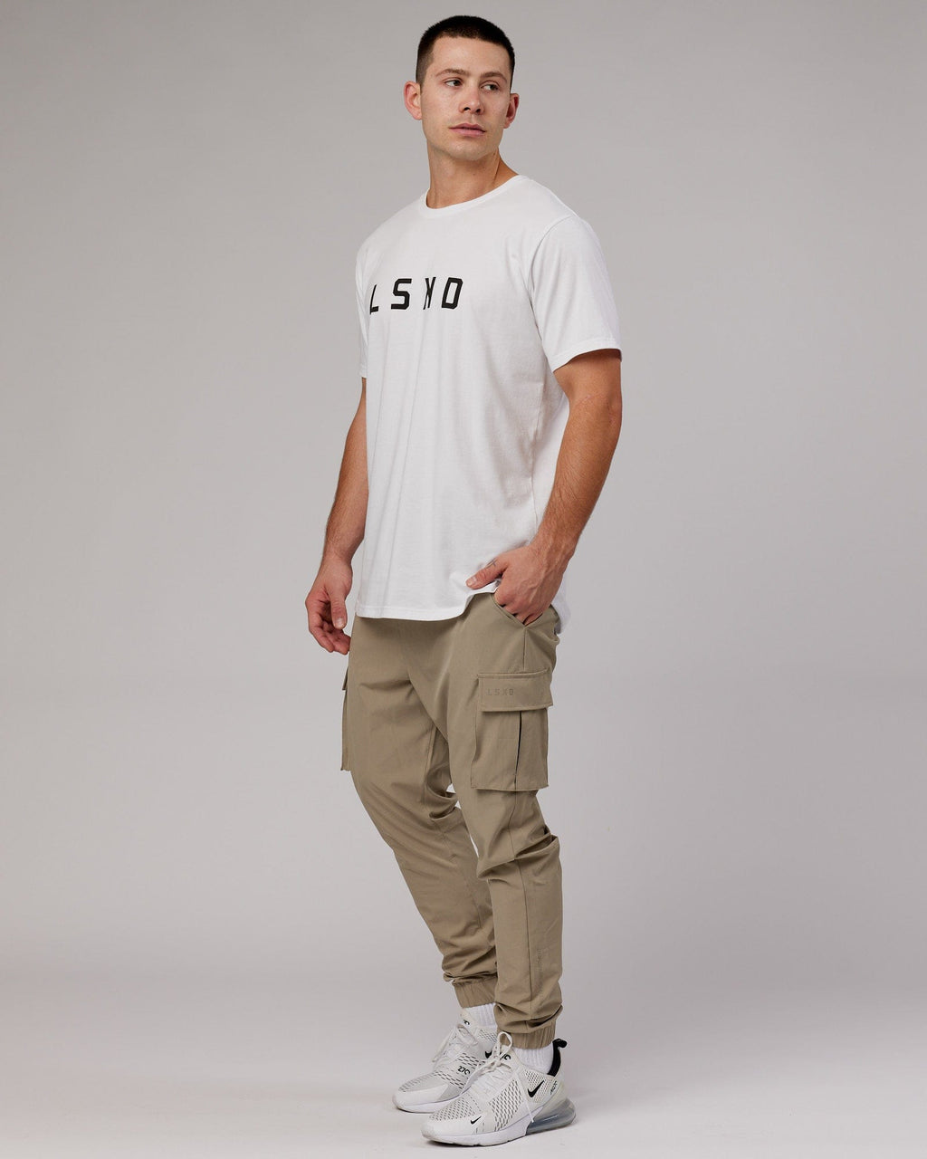 Model wearing Energy Stretch Performance Cargo Jogger - Laurel Oak