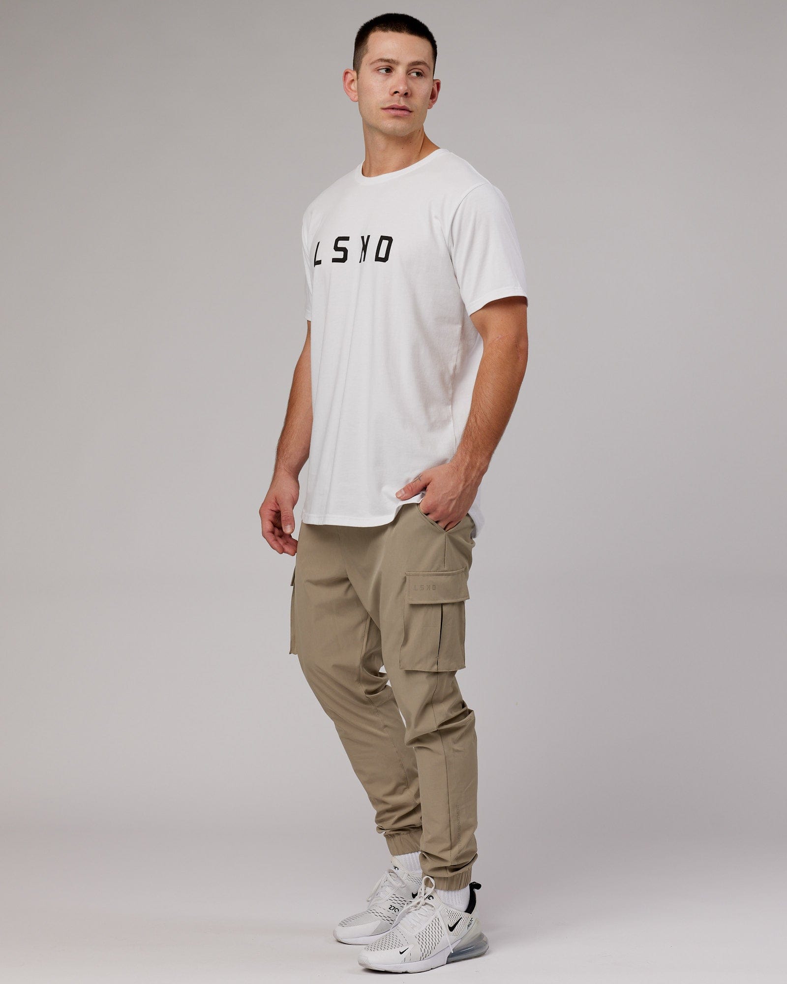 Model wearing Energy Stretch Performance Cargo Jogger - Laurel Oak