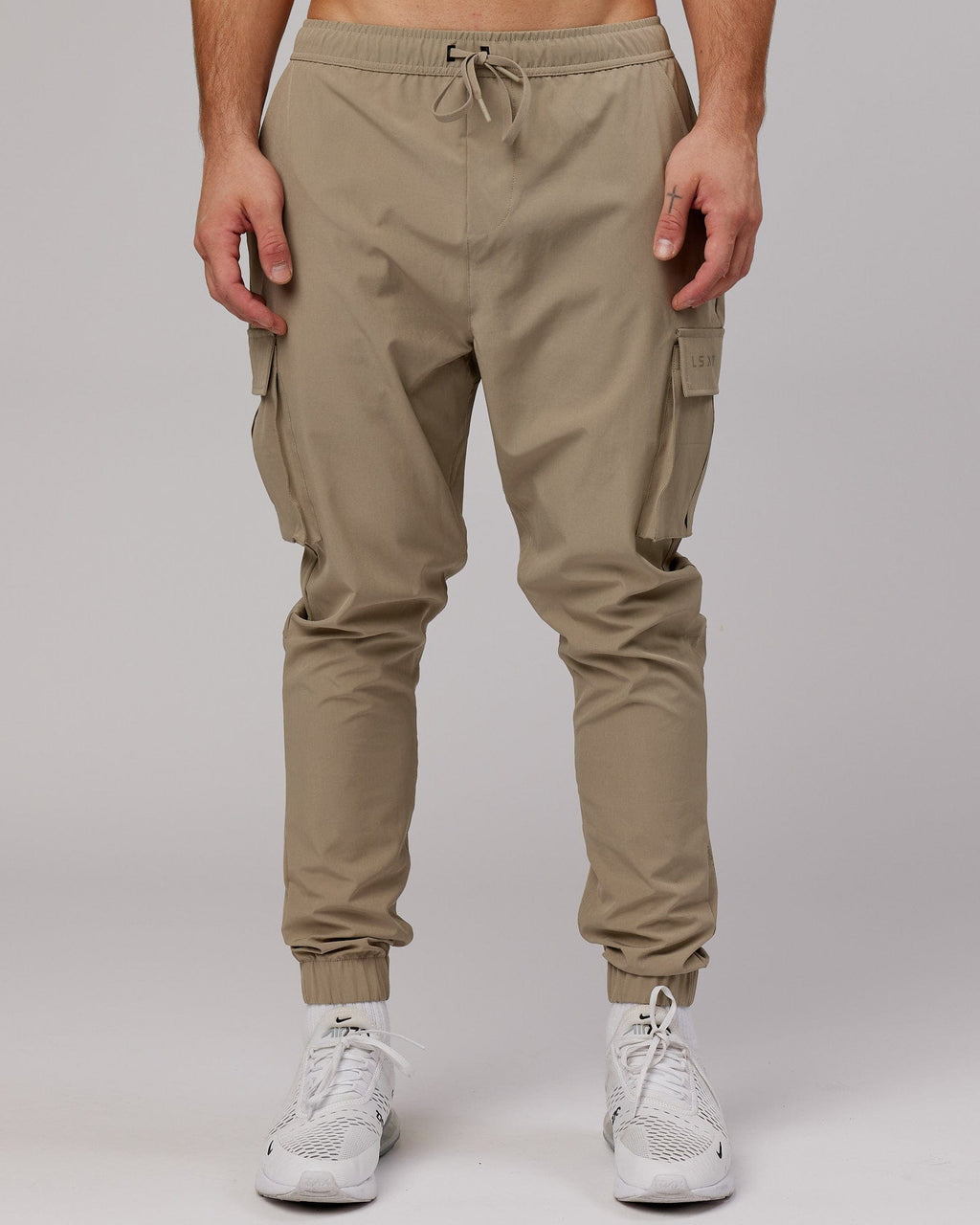 Model wearing Energy Stretch Performance Cargo Jogger - Laurel Oak