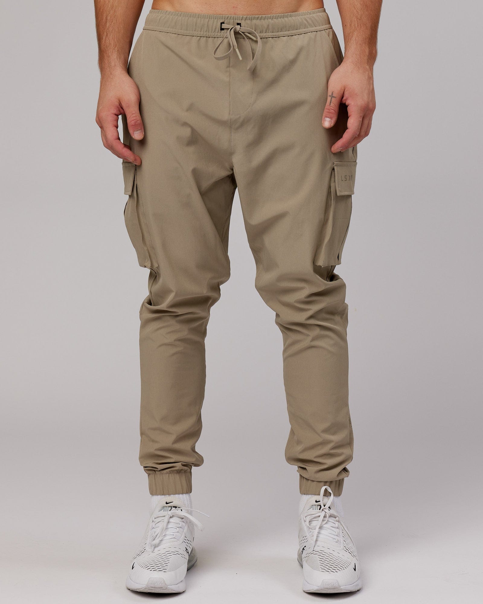 Model wearing Energy Stretch Performance Cargo Jogger - Laurel Oak