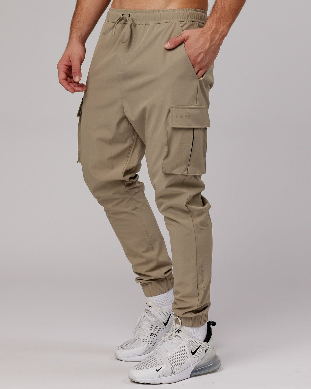 Model wearing Energy Stretch Performance Cargo Jogger - Laurel Oak