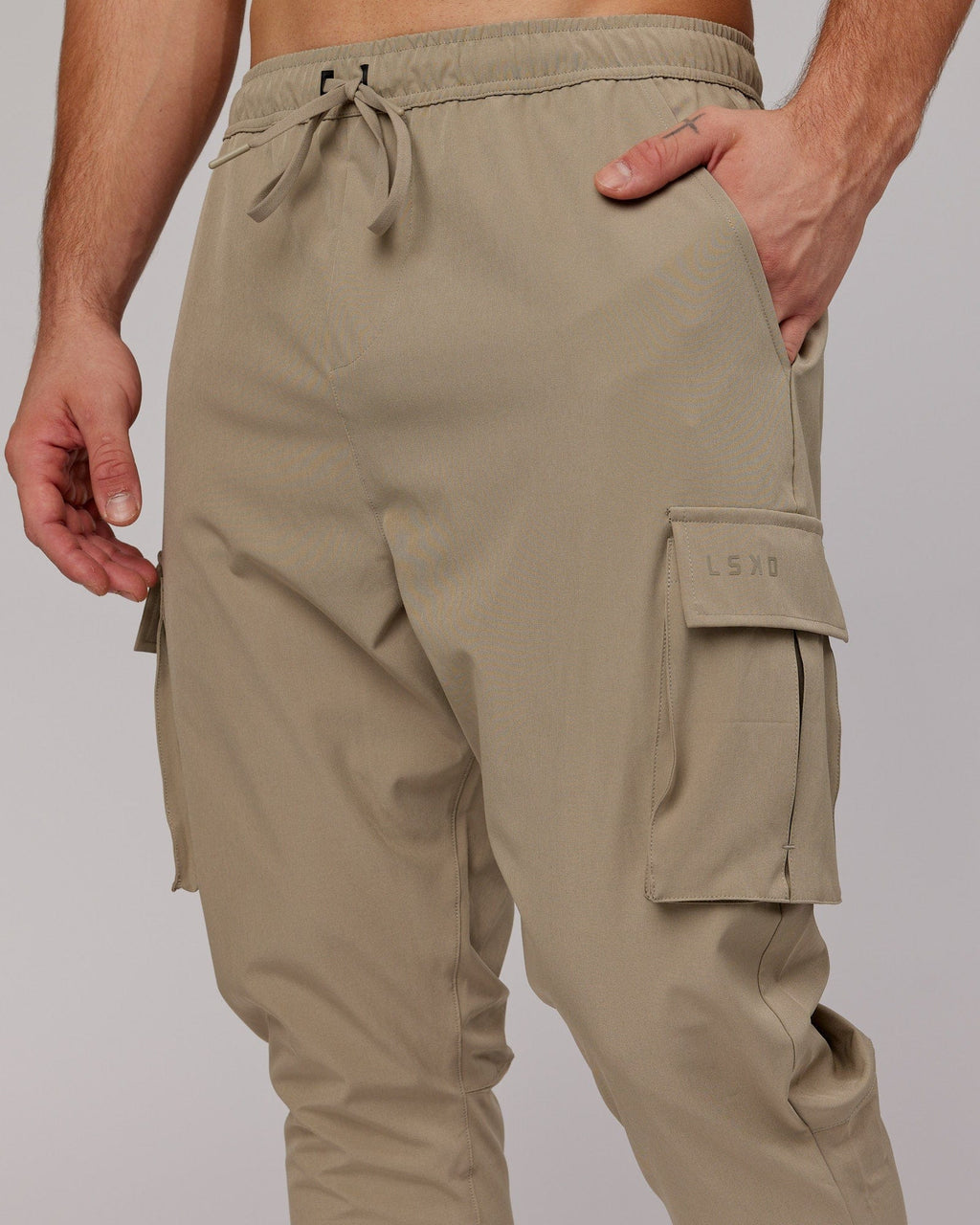 Model wearing Energy Stretch Performance Cargo Jogger - Laurel Oak