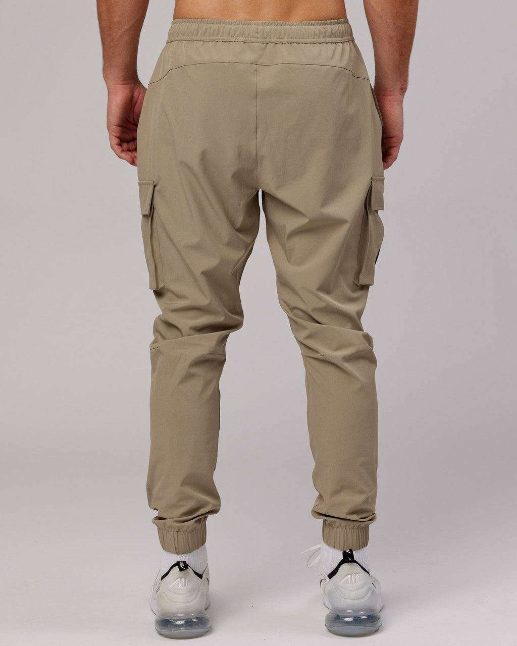 Model wearing Energy Stretch Performance Cargo Jogger - Laurel Oak
