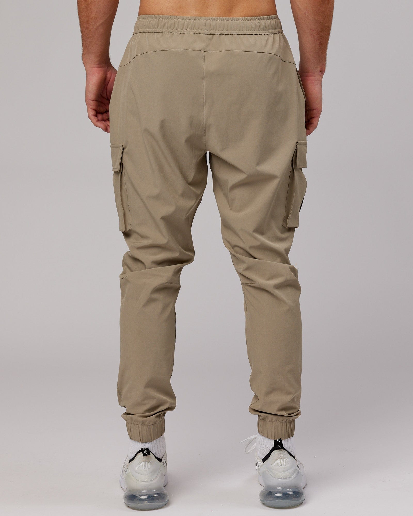 Model wearing Energy Stretch Performance Cargo Jogger - Laurel Oak