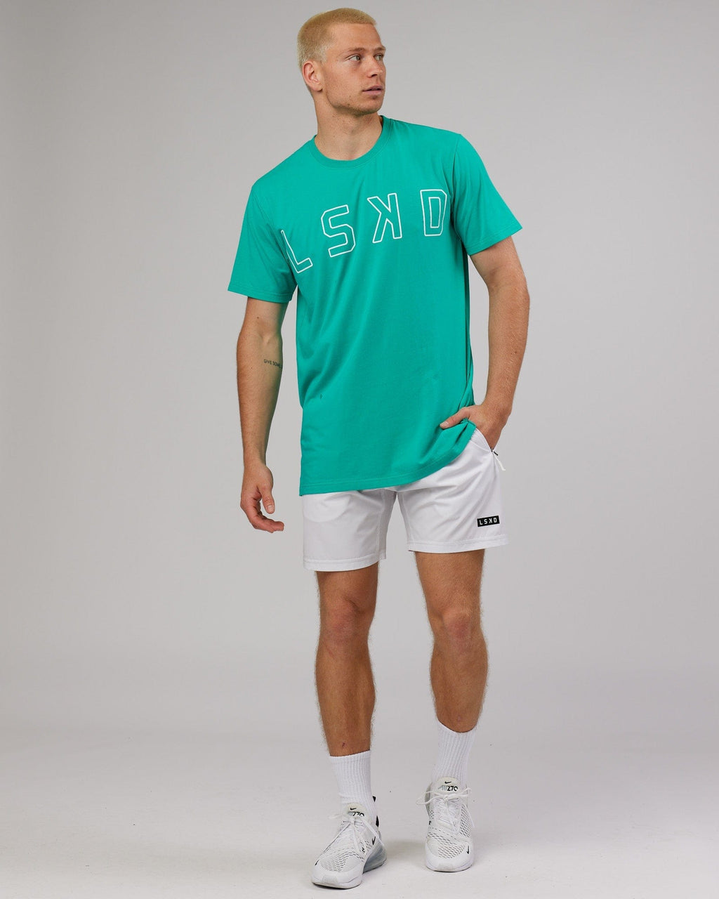 Model wearing Expand FLXCotton Tee - Hyper Teal