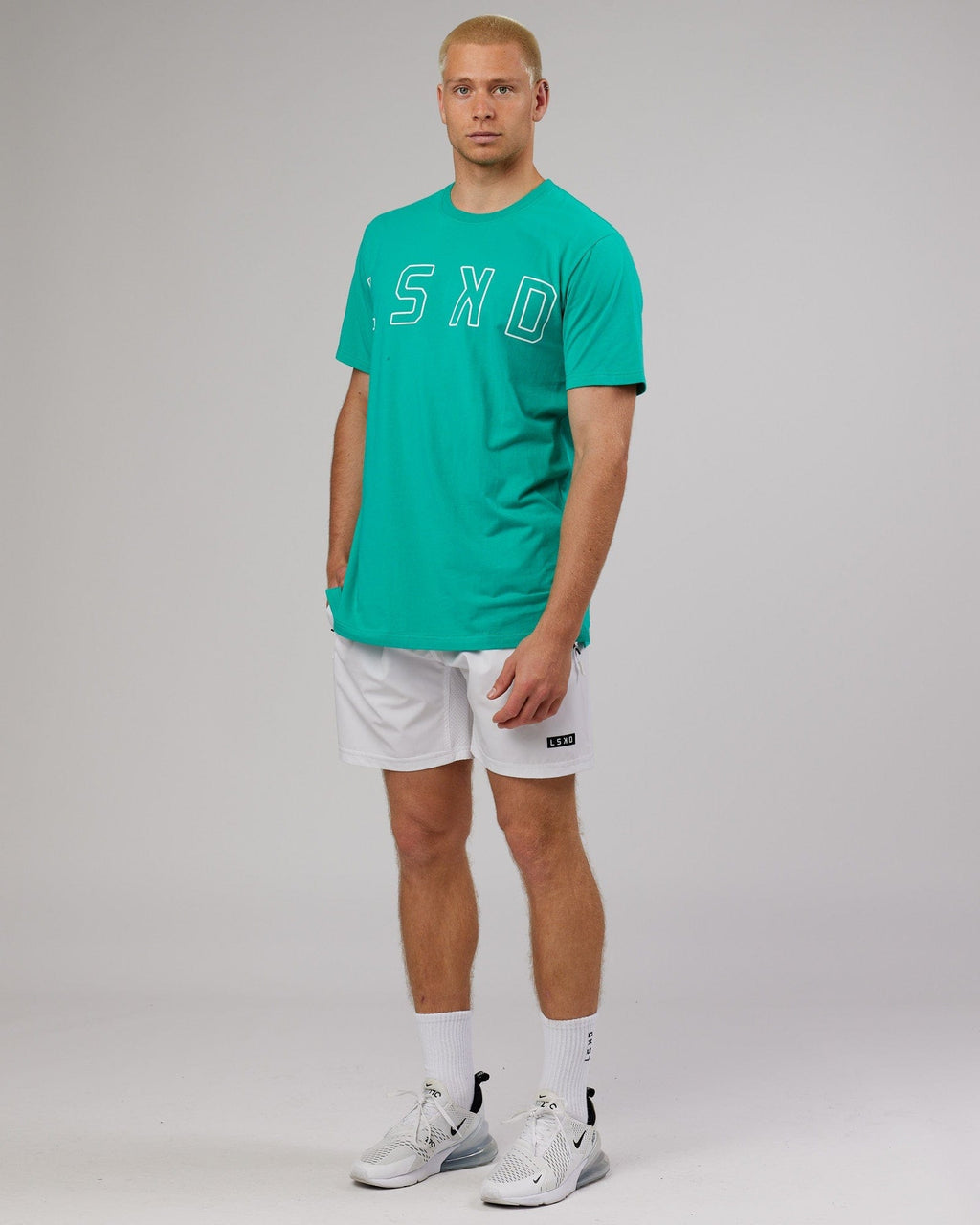Model wearing Expand FLXCotton Tee - Hyper Teal