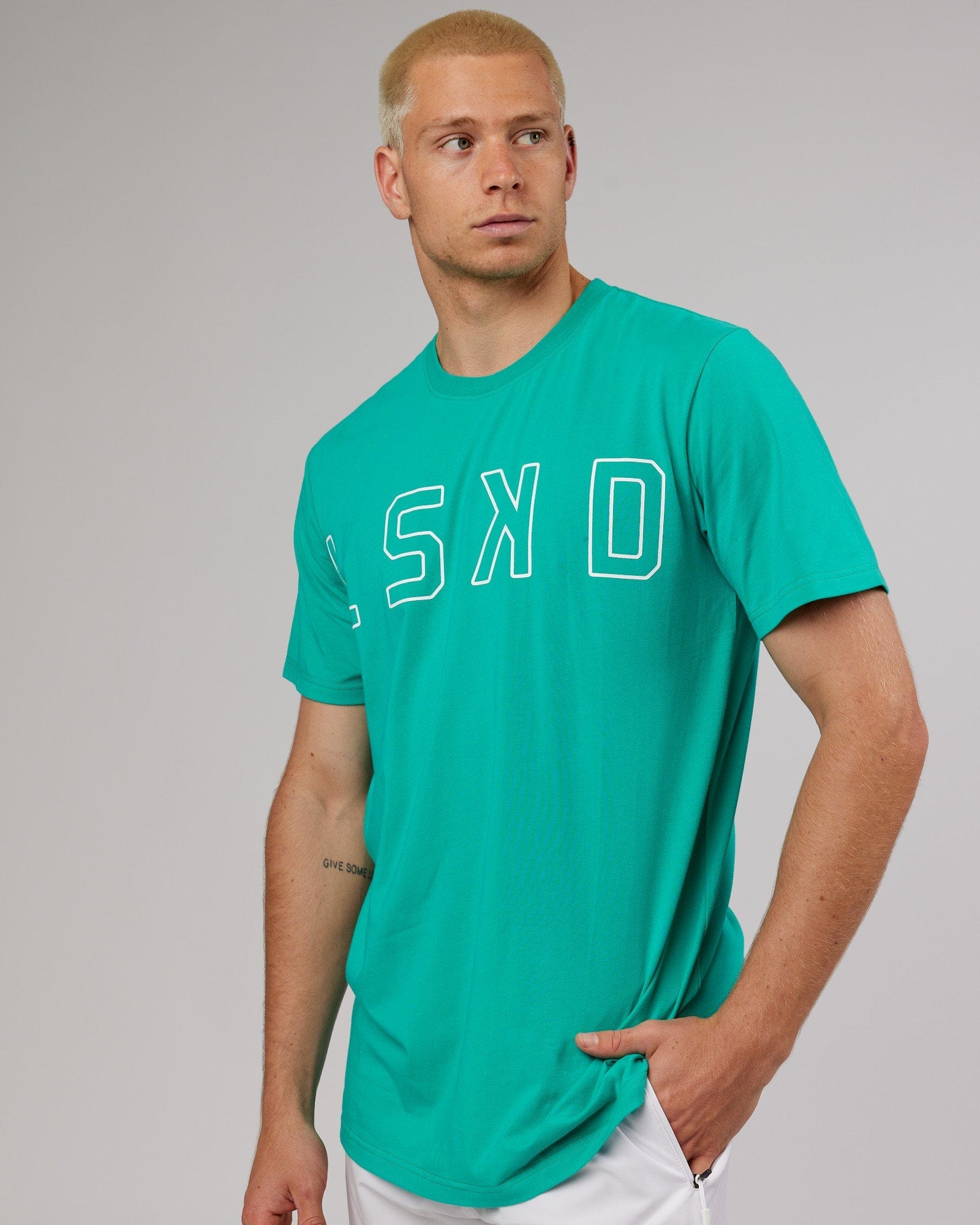 Model wearing Expand FLXCotton Tee - Hyper Teal