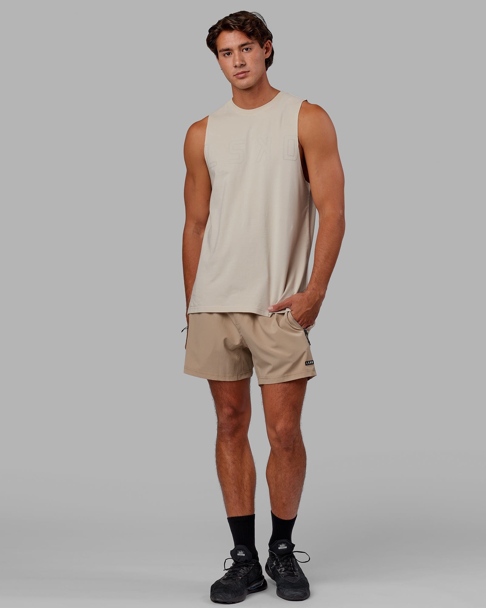 Model wearing Expand FLXCotton Training Fit Tank - Bone-Bone