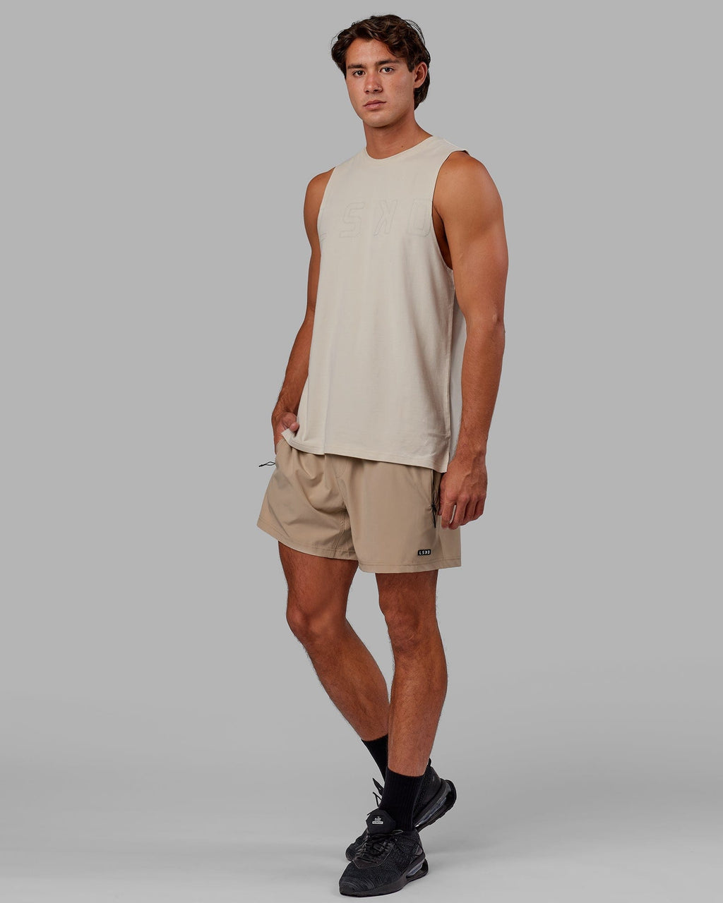 Model wearing Expand FLXCotton Training Fit Tank - Bone-Bone