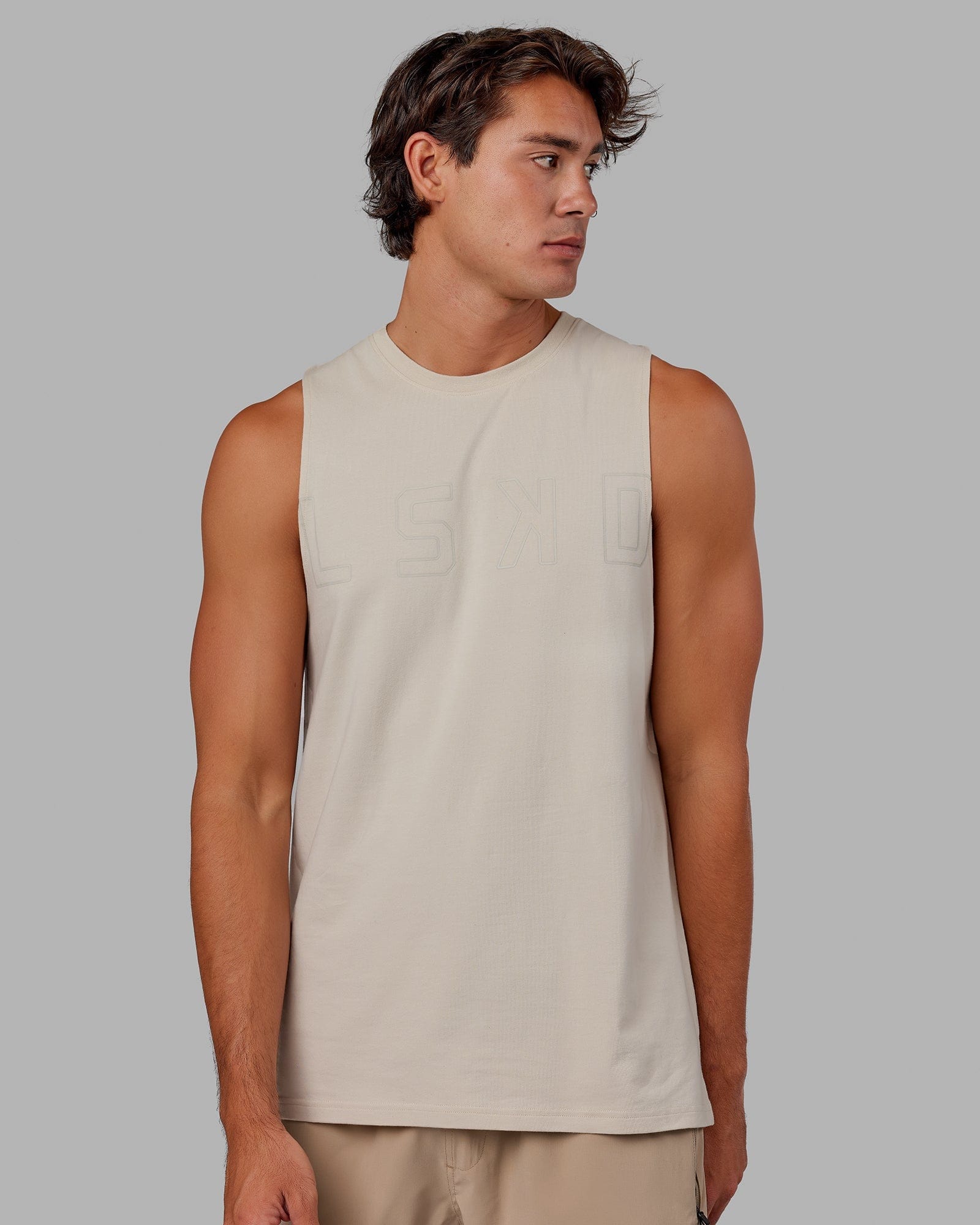 Model wearing Expand FLXCotton Training Fit Tank - Bone-Bone