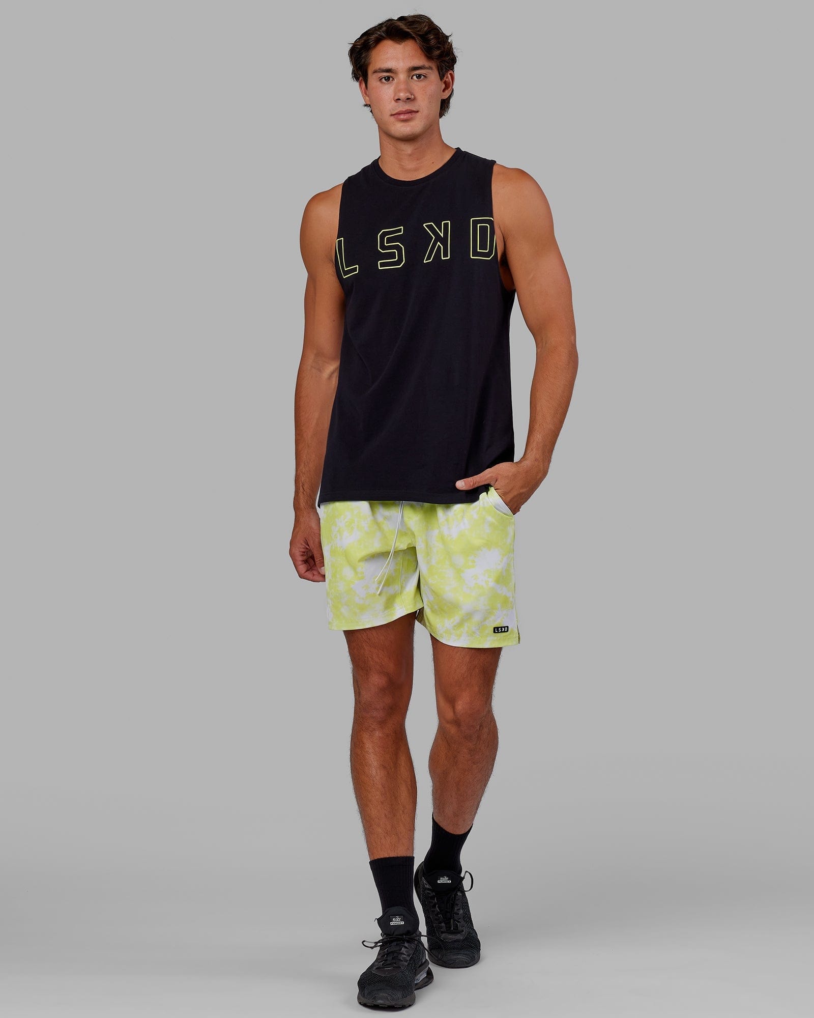 Model wearing Expand FLXCotton Training Fit Tank - Black-Citrus Green
