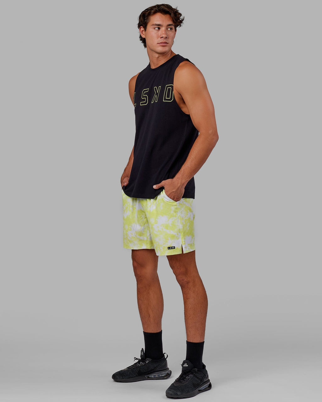 Model wearing Expand FLXCotton Training Fit Tank - Black-Citrus Green
