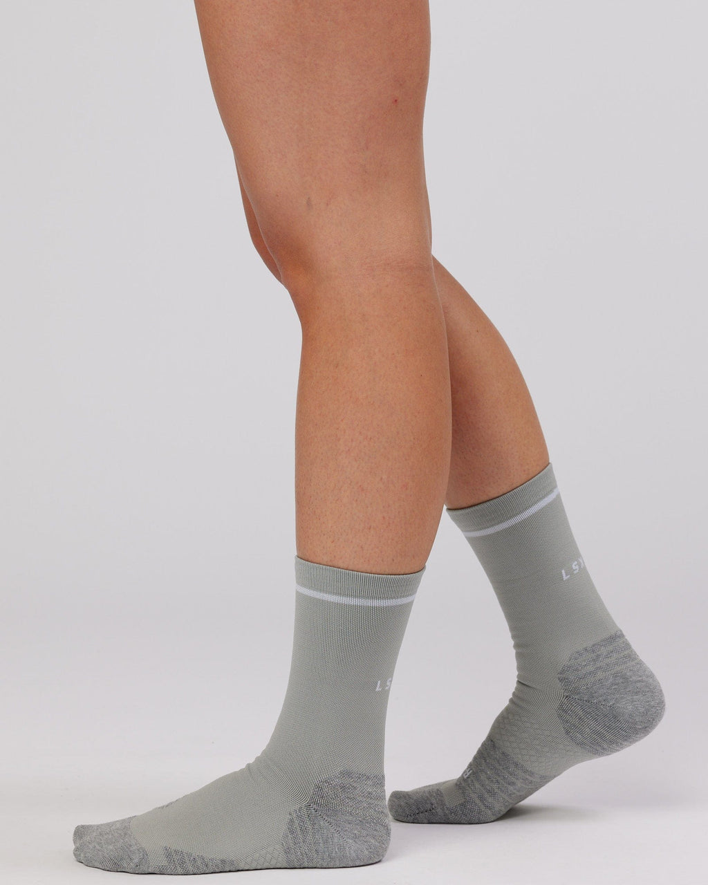 Model wearing Fast Performance Sock - Light Grey Marl