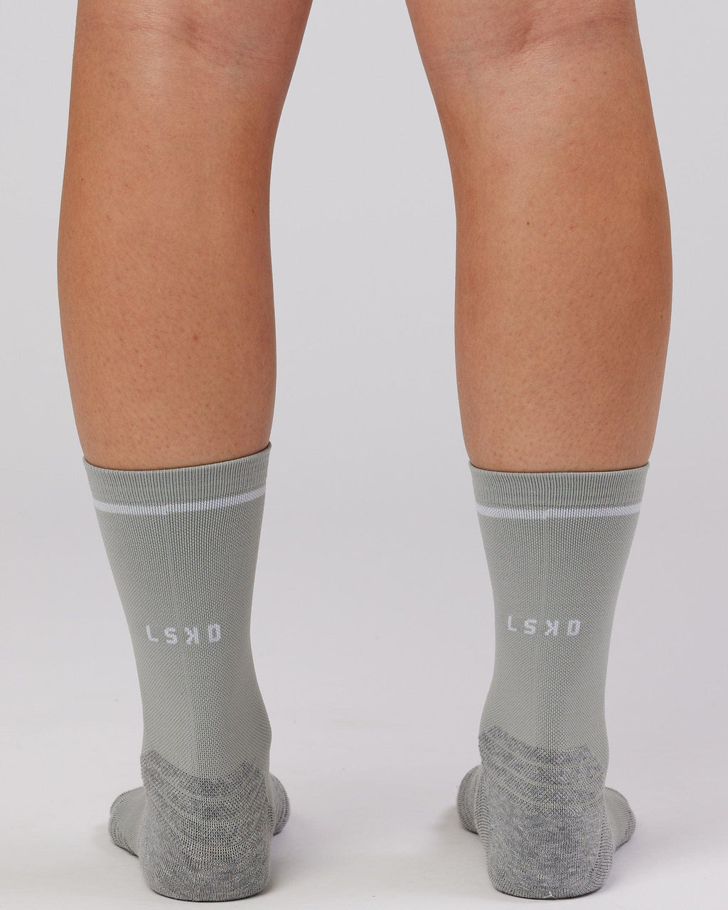 Model wearing Fast Performance Sock - Light Grey Marl