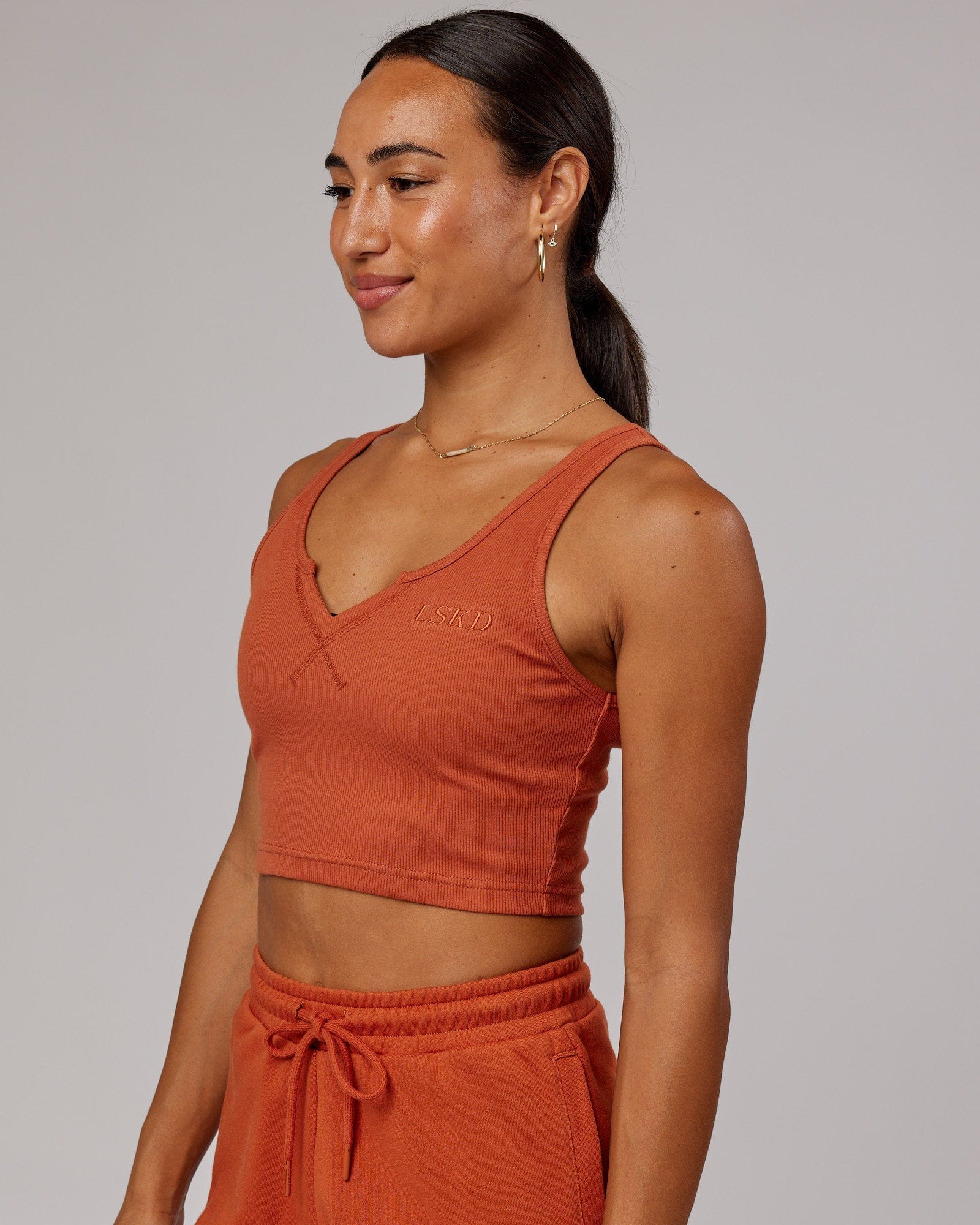 Model wearing Field Ribbed V-Neck Tank - Auburn