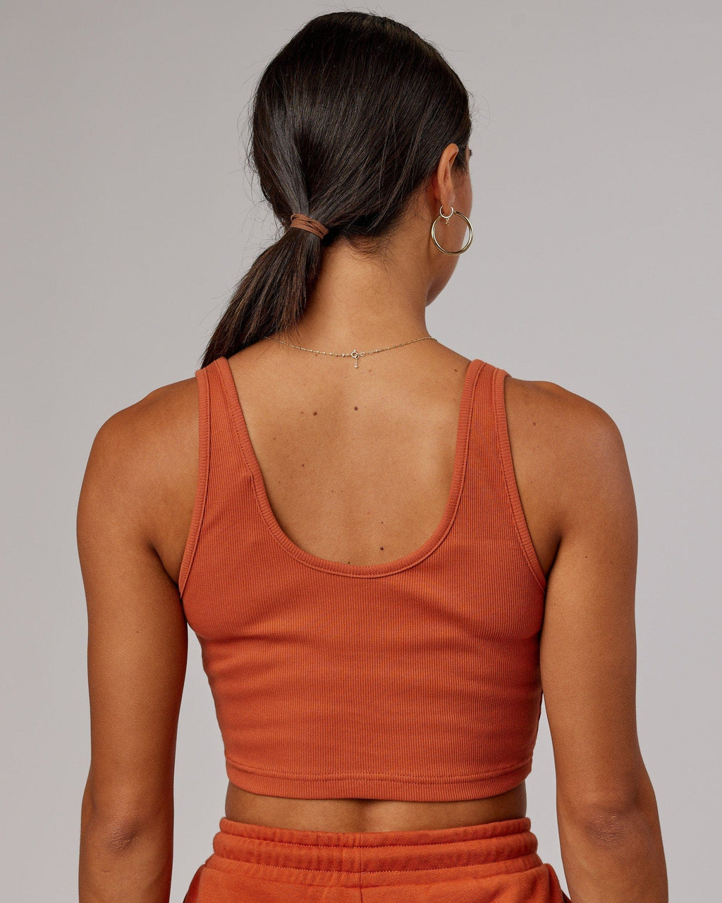 Model wearing Field Ribbed V-Neck Tank - Auburn