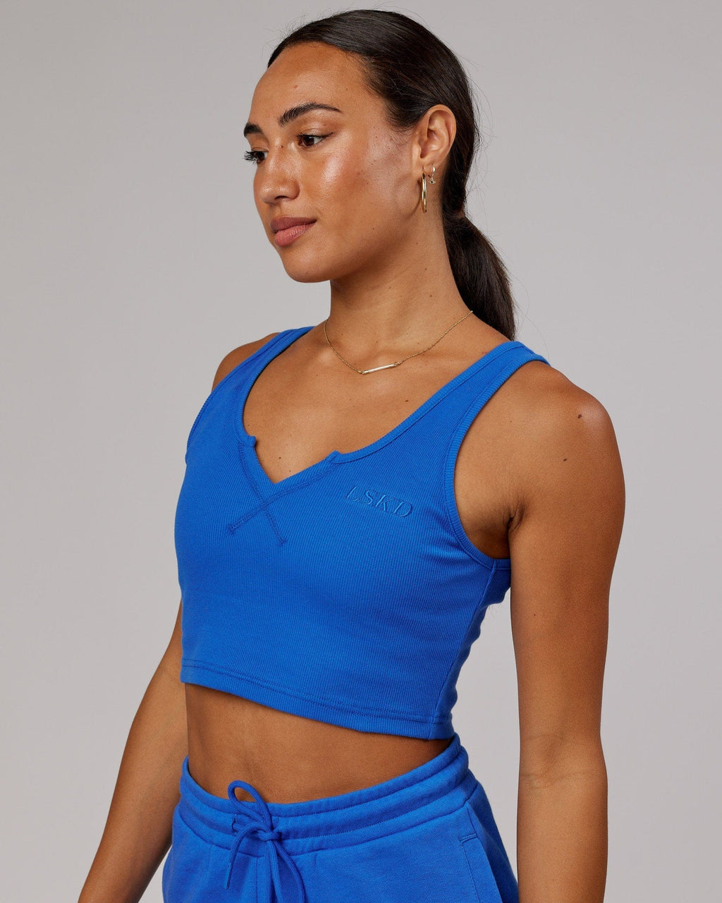 Model wearing Field Ribbed V-Neck Tank - Strong Blue