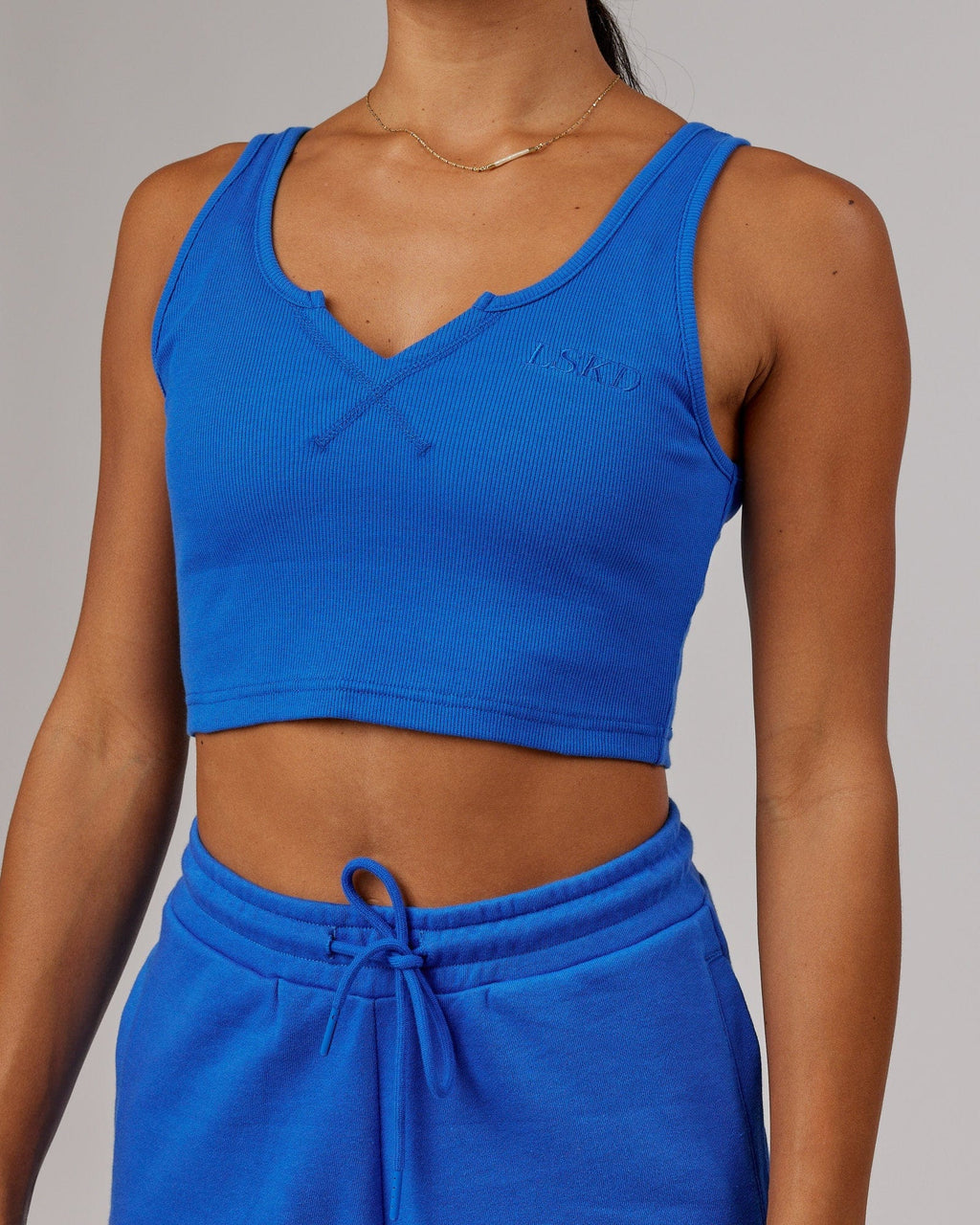 Model wearing Field Ribbed V-Neck Tank - Strong Blue