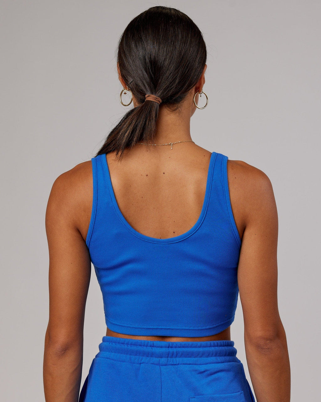 Model wearing Field Ribbed V-Neck Tank - Strong Blue