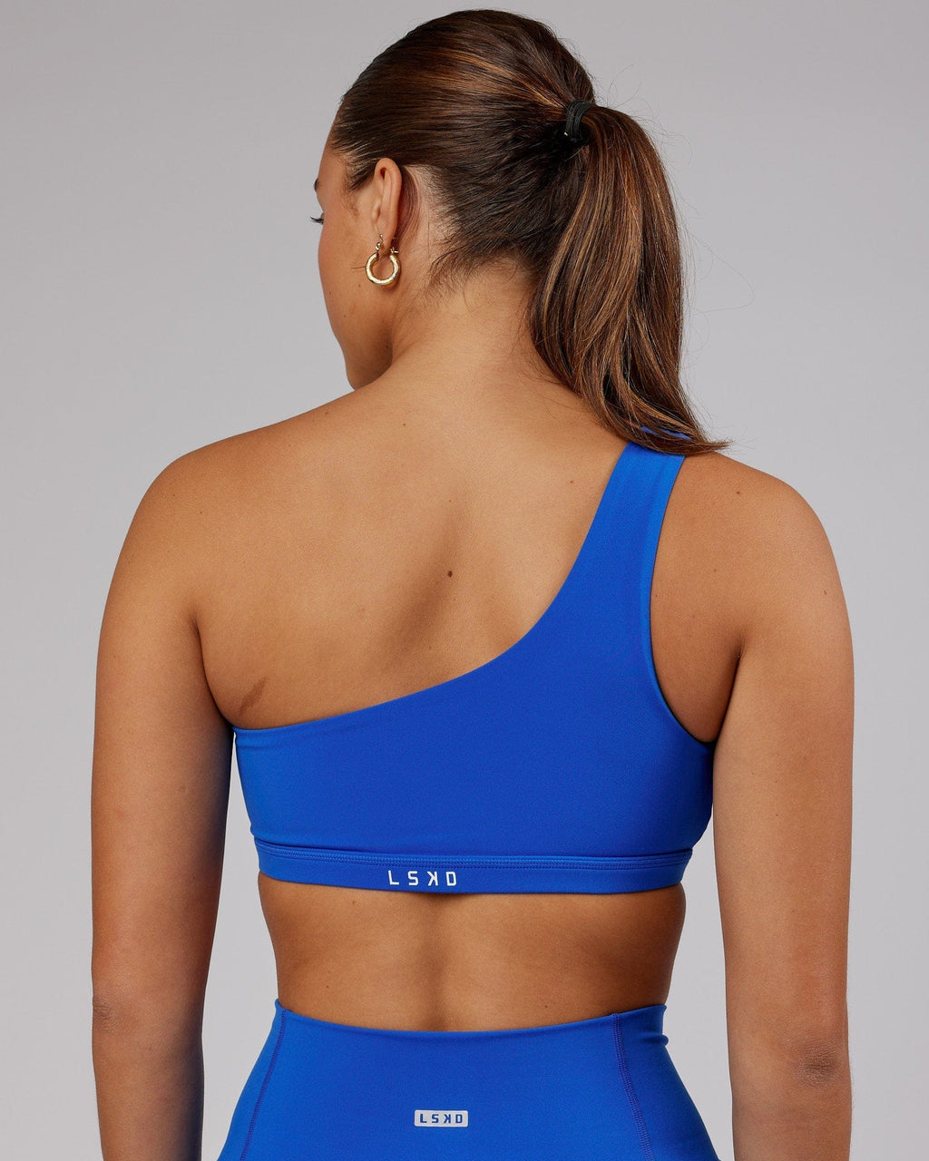 Model wearing Flex Sports Bra - Strong Blue
