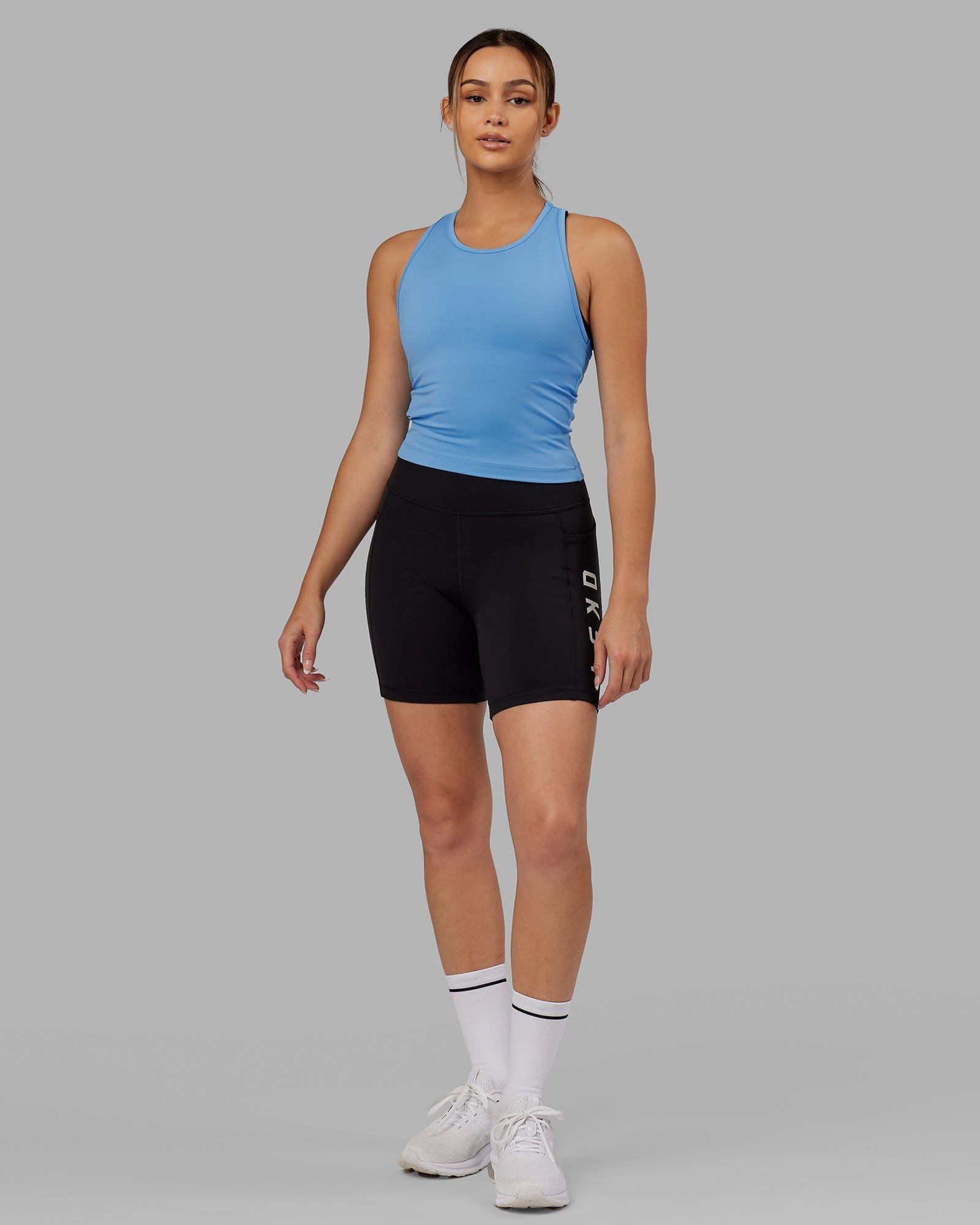 Model wearing Flow Performance Tank - Azure Blue