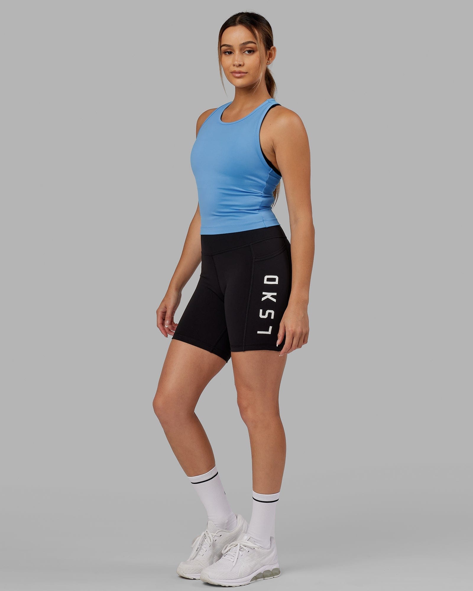 Model wearing Flow Performance Tank - Azure Blue