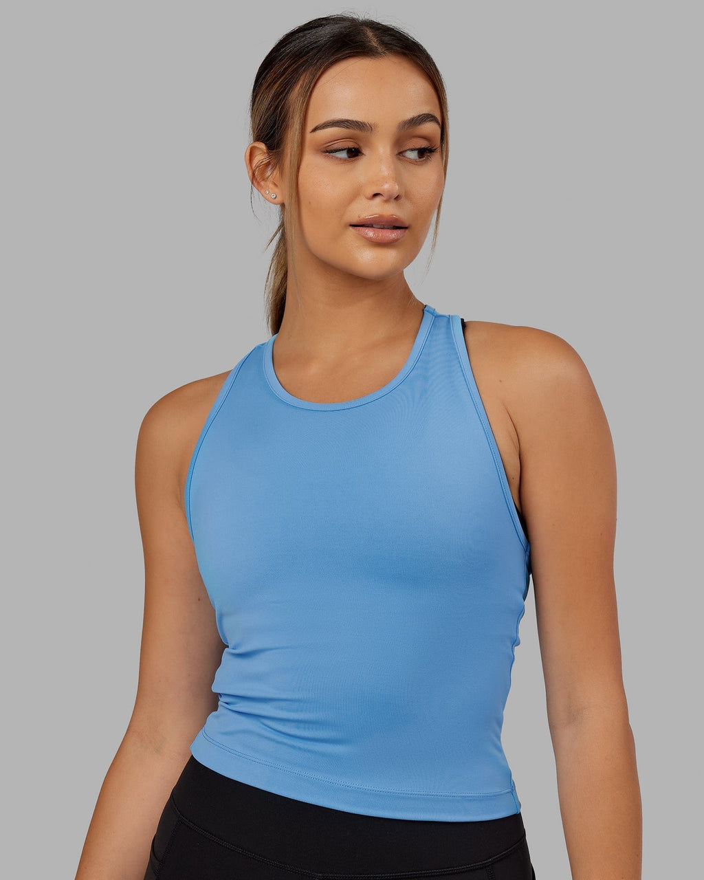 Model wearing Flow Performance Tank - Azure Blue