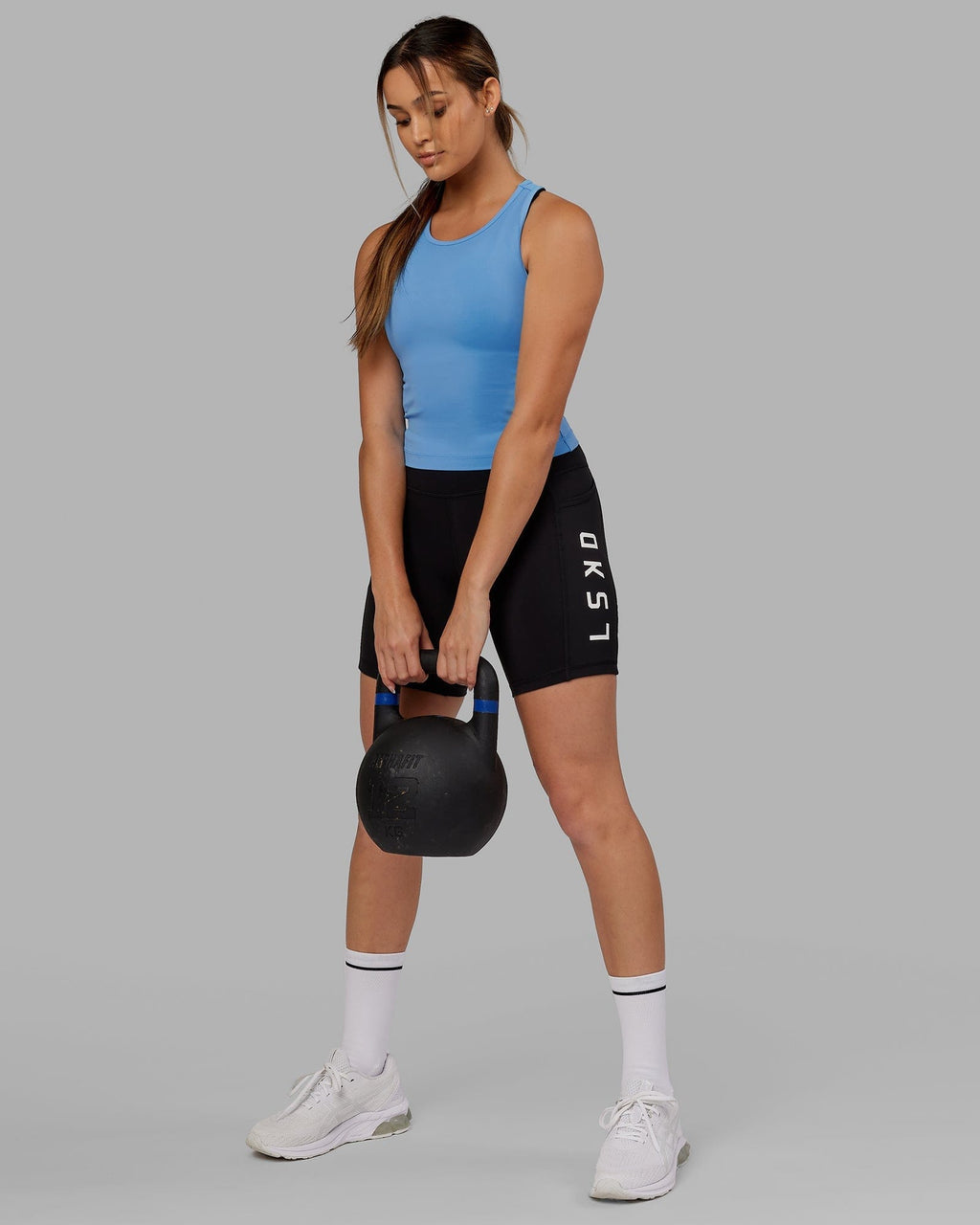 Model wearing Flow Performance Tank - Azure Blue