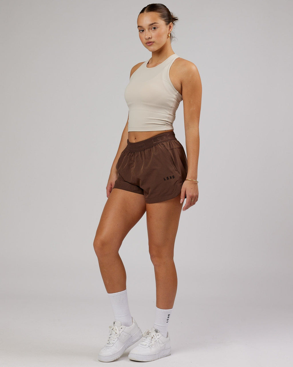 Model wearing Flow Performance Tank - Silver Grey