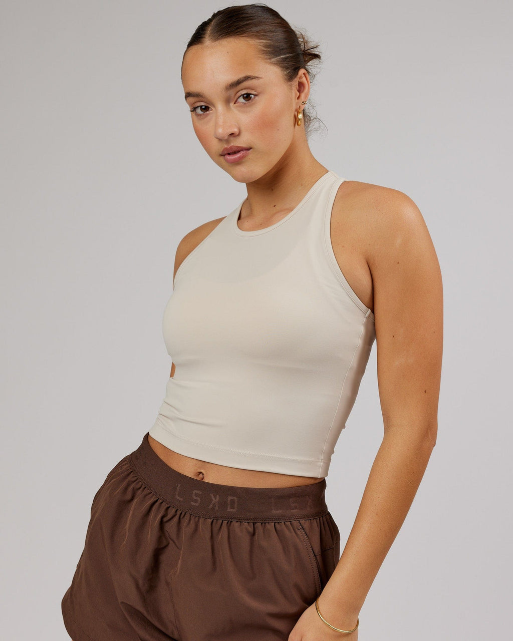 Model wearing Flow Performance Tank - Silver Grey