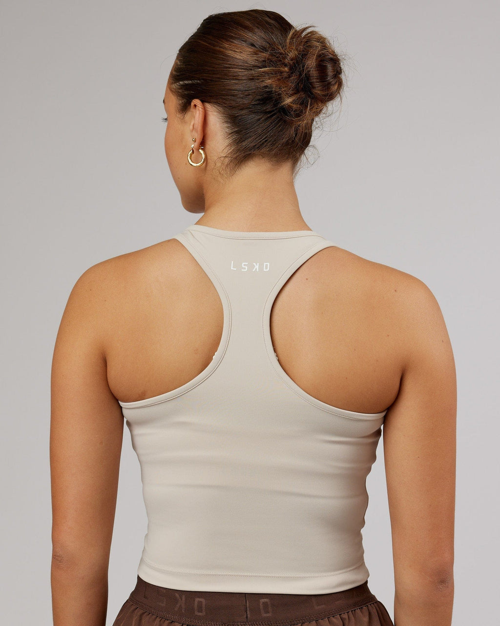 Model wearing Flow Performance Tank - Silver Grey