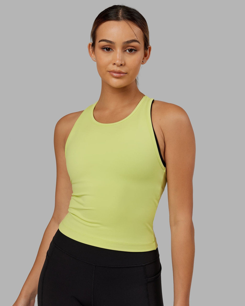 Model wearing Flow Performance Tank - Pale Citrus