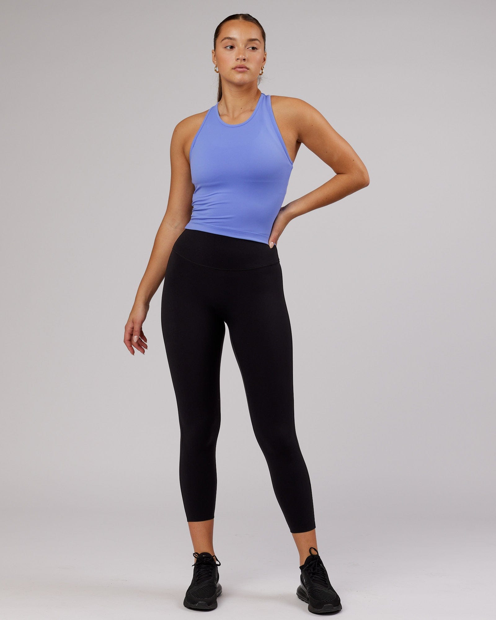 Model wearing Flow Performance Tank - Cornflower Blue