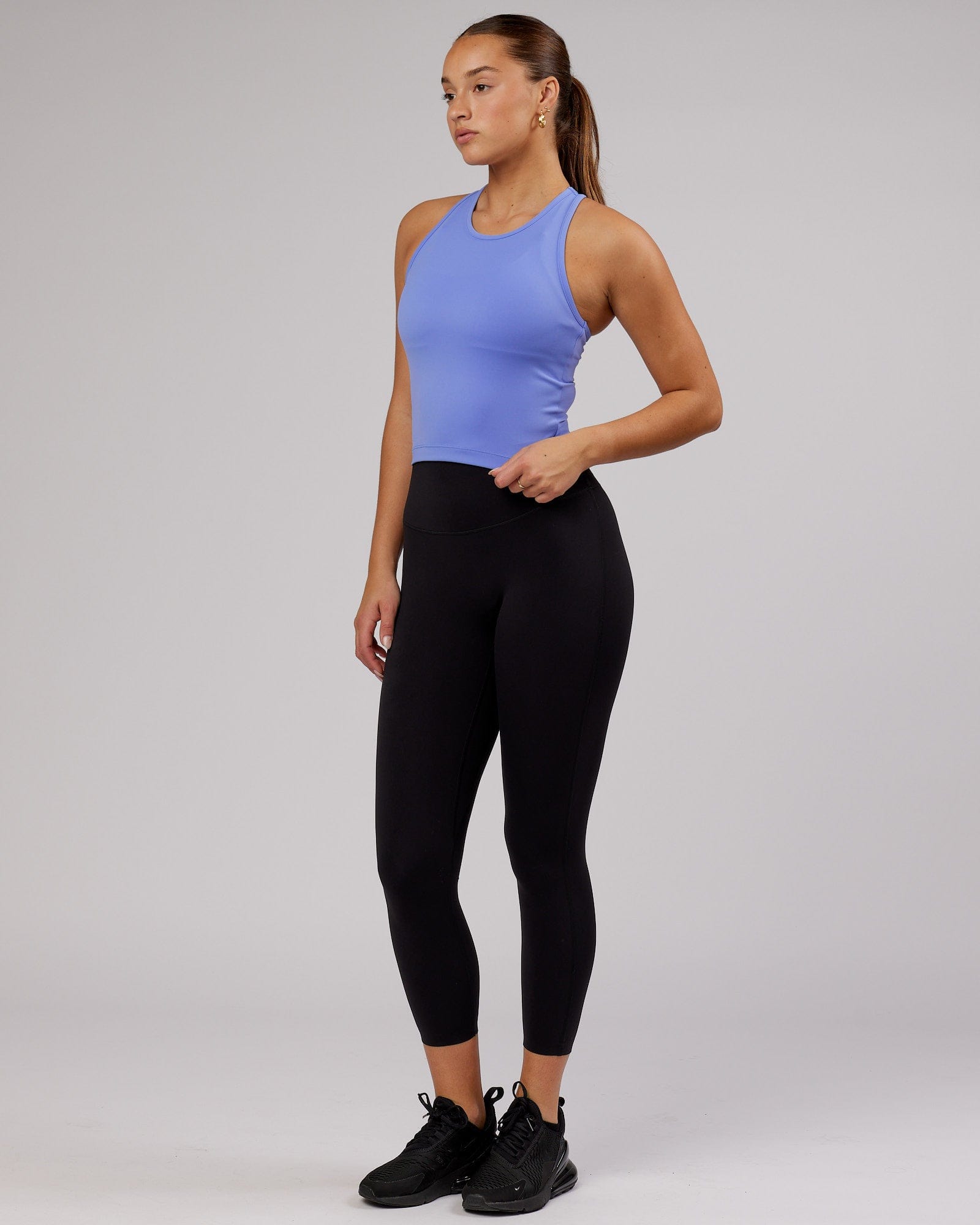 Model wearing Flow Performance Tank - Cornflower Blue