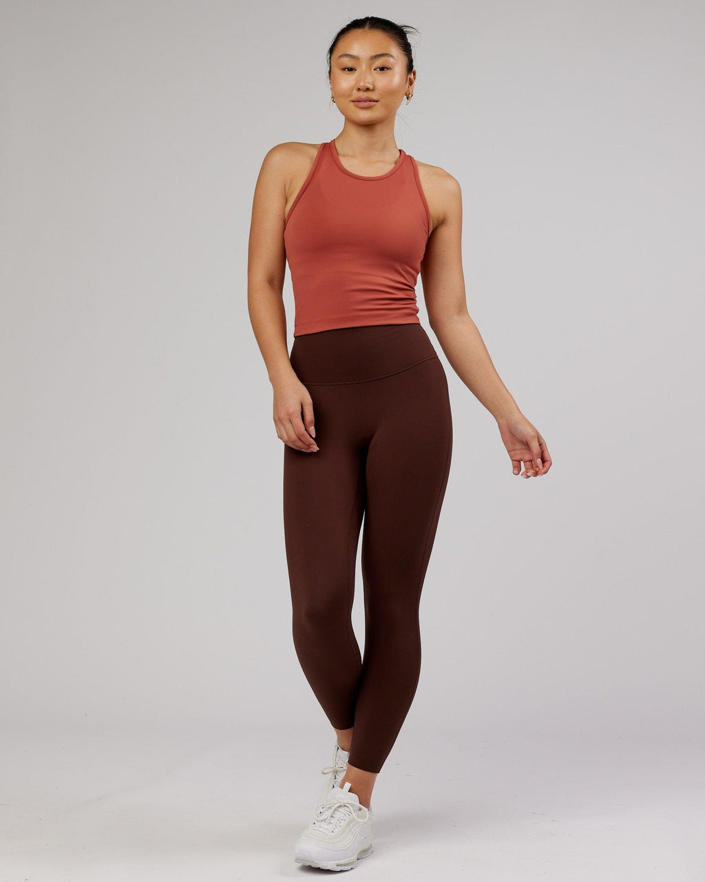 Model wearing Flow Performance Tank - Marsala