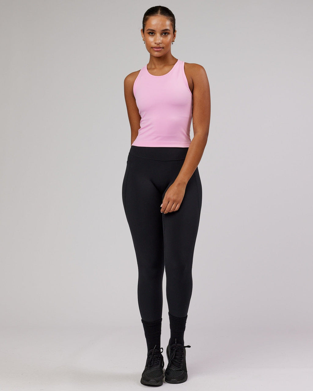 Model wearing Flow Performance Tank - Pink Frosting