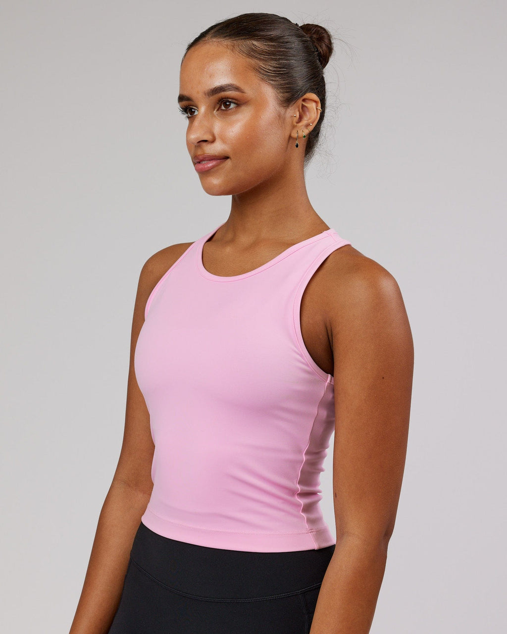 Model wearing Flow Performance Tank - Pink Frosting