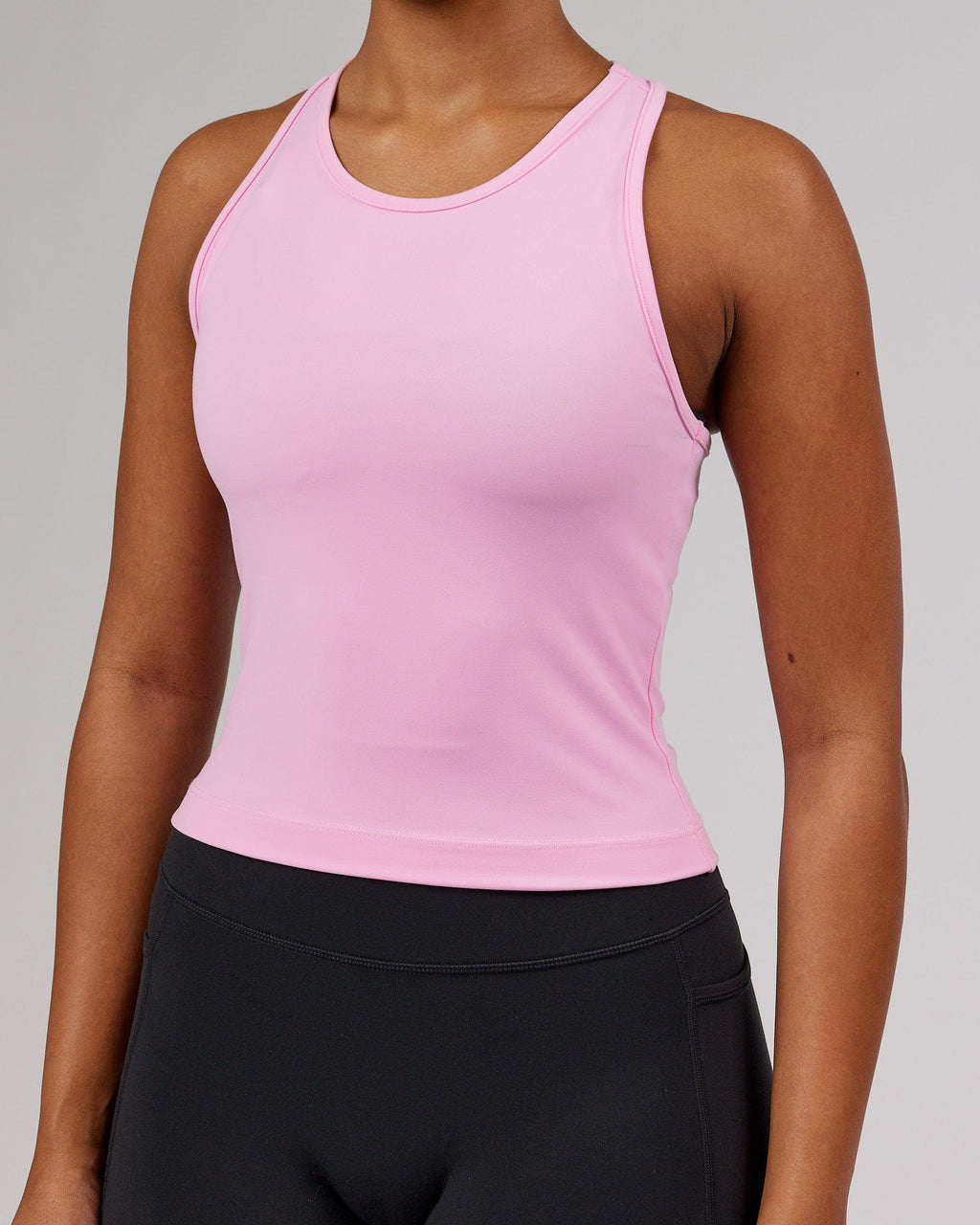 Model wearing Flow Performance Tank - Pink Frosting