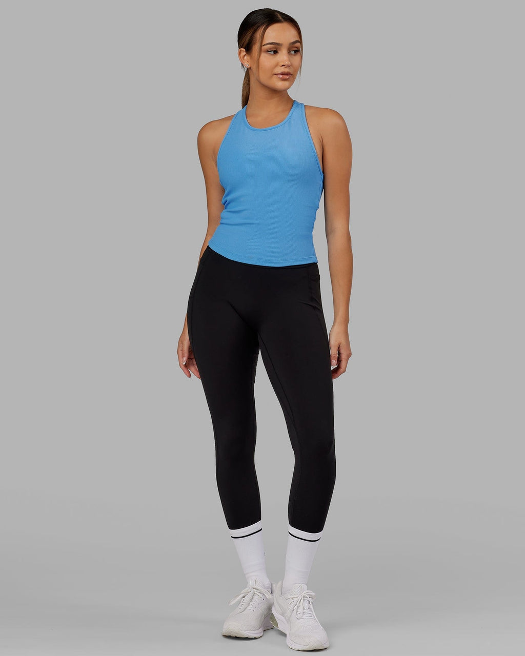 Model wearing Flow Ribbed Shelf Bra Performance Tank - Azure Blue